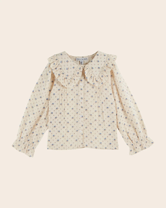 ecru blouse with blue flowers